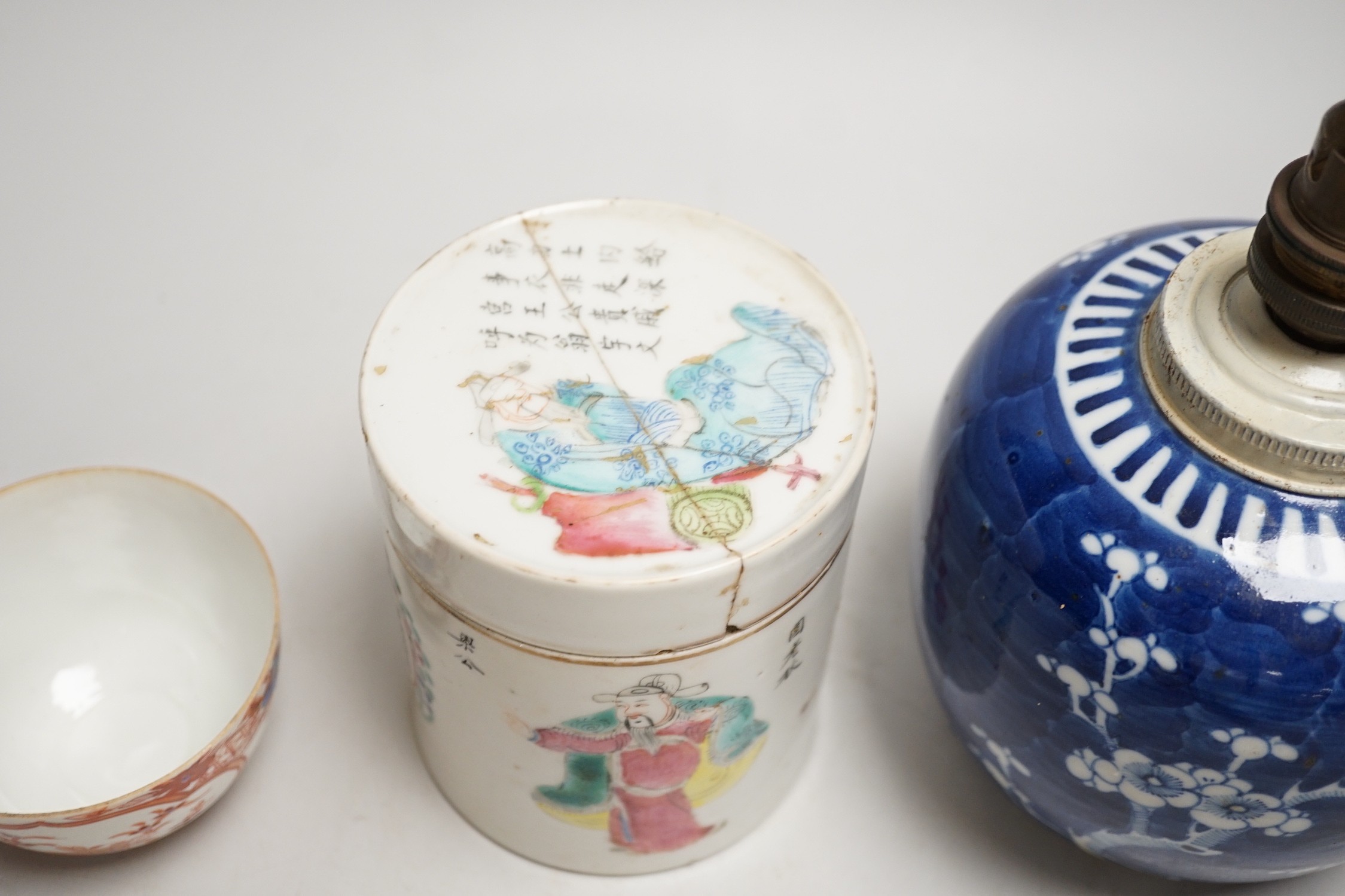 A 19th century Chinese famille rose cylindrical jar and cover, 11.5cm high, a blue and white prunus lamp and a Japanese eggshell porcelain cup